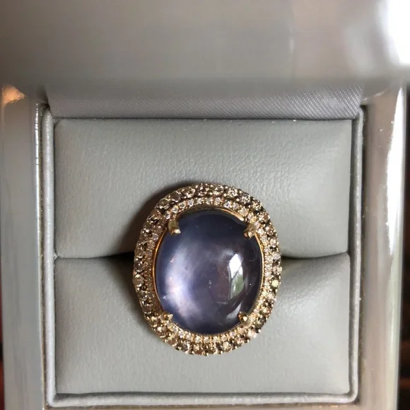 19 ct Star Sapphire surrounded by Diamonds in gold - Picture 4 of 15